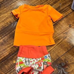 Orange rash guard and swim diaper set